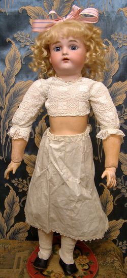   Antique Doll c.1910 20 w/the most beautiful blue sleep eyes $1  