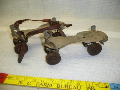 vintage metal roller skates with leather strap antique  