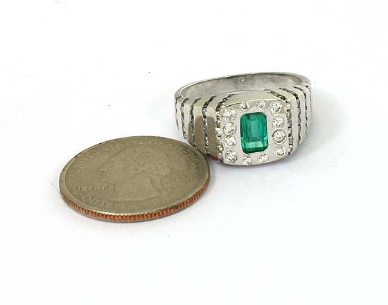 this is a trendy 14k gold diamonds and emerald solitaire band